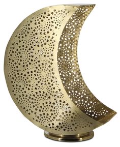 a golden moon sculpture on a white background