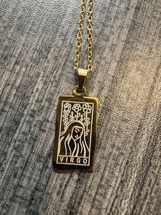 a necklace with an image of a woman on it