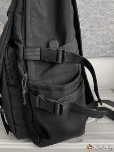 a black backpack sitting on top of a counter