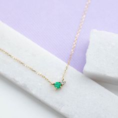 A dainty necklace in 14K gold with natural emerald and diamond in cluster set. This necklace is ideal as everyday jewelry and a great option for a birthday gift as emerald is May birthstone. D E T A I L S● Metal: 14K solid gold, 14K white gold or 14K rose gold● Gemstones: Emerald, round cut 3mm, Diamond, brilliant cut, 2mm● Gemstones Weight: 0.10 ct, 0.03 ct● Length: 40 cm - 16 inchesH O W ∙ T O ∙ O R D E RChoose from the drop-down menu the available options (Metal) and leave us a note for any s Everyday Yellow Gold Emerald Necklace For May Birthstone, Dainty Emerald Necklace For May Birthstone, Dainty Emerald Necklace In 14k Yellow Gold, Yellow Gold Diamond Necklace For May Birthstone, Dainty Emerald Birthstone Necklace For May, Dainty Yellow Gold Emerald Necklace For Anniversary, Dainty 14k Gold Emerald Necklace Gift, Dainty 14k Gold Emerald Necklace, Minimalist Emerald Necklace For Anniversary