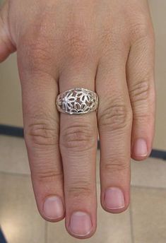 Stylish sterling silver ring, flower band 925/1000. Stamped 925.Approximate weight 5.3 grams. Top width 1.3 cm (0.52 inches). All our jewels are made from solid sterling silver 925/1000 and are carefully crafted by hand in our family workshop. We dispatch your orders in 5 working days, worldwide and the postage is $5. We ship registered priority mail. Please allow 5-7 working days for delivery in Europe and 10-15 working days outside Europe. For any questions - please do not hesitate to contact Flower Shaped Ring With Intricate Design For Anniversary, White Gold Flower Ring Stamped 925, Silver Flower Ring With Intricate Design For Anniversary, Anniversary Flower Ring With Intricate Design, Sterling Silver Filigree Ring Stamped 925, Classic Silver Flower Ring Stamped 925, Hallmarked Sterling Silver Flower Ring For Anniversary, Elegant Sterling Silver Engraved Flower Ring, Elegant Flower Shaped Ring Stamped 925