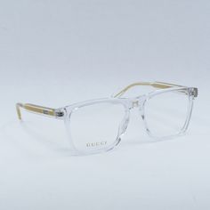 Welcome to OSSA FRAMES, your go-to destination for luxury eyewear! Step into style with the Gucci GG0561ON 005 Shiny Crystal prescription eyeglasses. Crafted by the renowned fashion house Gucci, these designer glasses exude elegance and sophistication. The frame color of Shiny Crystal adds a touch of glamour to your everyday look, while the clear demo lens provides a sleek and modern finish. The square style of these eyeglasses is perfect for women who are looking to make a bold statement with t Modern Gucci Glass Sunglasses, Gucci Clear Square Frame Sunglasses, Gucci Designer Clear Sunglasses, Designer Gucci Clear Sunglasses, Gucci Clear Glass Sunglasses, Luxury Clear Gucci Sunglasses, Classic Gucci Glass Sunglasses, Formal Gucci Sunglasses With Glass Lenses, Designer Clear Sunglasses For Formal Occasions