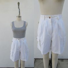 "90s all cotton stark white pleated cargo shorts. Four front pockets and tow back pockets. All cotton fabric has a slightly velvety feel to it. Made in Turkey for POINTS WEST.  Label Size 10 29\" Waist 12-1/2\" rise 43\" hips 7-1/2\" inseam    New old stock, but I removed the tags and washed them to freshen them up." White High Waist Cotton Bermuda Shorts, Vintage Cotton Shorts With Cargo Pockets, High-waisted Cotton Cargo Shorts With Multiple Pockets, High-waisted Cotton Shorts With Multiple Pockets, White Bermuda Shorts With Pockets, White Cargo Shorts For Spring, Spring White Cargo Shorts, Vintage Cotton Cargo Shorts With Pockets, White Cargo Shorts With Side Pockets For Spring