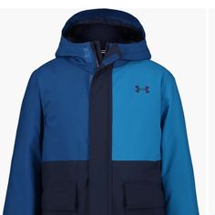 Blue Under Armor Jacket Size 4 Blue Winter Sports Outerwear, Blue Parka With Pockets For Outdoor Activities, Blue Long Sleeve Parka With Fleece Lining, Blue Outerwear For Winter Sports, Blue Winter Outerwear For Outdoor Activities, Navy Outerwear For Hiking In Fall, Navy Outerwear For Fall Hiking, Blue Hooded Parka For Outdoor Activities, Blue Parka For Outdoor Activities