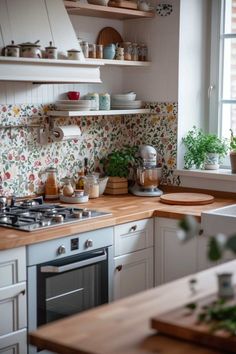 a kitchen filled with lots of counter top space next to a stove top oven and sink