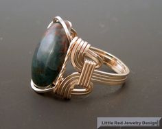 "Handcrafted 14 k Gold Filled Wire Heliotrope Bloodstone Cabochon Ring This style ring is often called a Pharaoh's ring due to the same style being found in the pyramids of Egypt. This ring is entirely handcrafted with 21 gauge 14 k gold filled wire wire. I generally do wrap all the ring shank in order to increase the durability of the ring as well as comfort. However, I am listing each ring to have it be your choice if the ring shank is wrapped. You can see a picture of the plain vs the wrapped The Pyramids Of Egypt, Pyramids Of Egypt, Bloodstone Ring, Wire Wrap Cabochon, The Pyramids, Wire Wrapped Ring, Wire Wrapping Stones, Gem Ring, Cabochon Ring