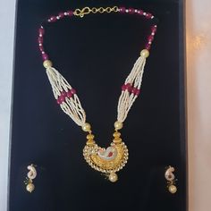 "IF YOU HAVE ANY DESIGN FOR JEWELRY OR NEED ANY GEMSTONE FOR JEWELRY PLEASE SHARE WITH US. BECAUSE WE ARE MANUFACTURER OF JEWELRY. WE MAKE IT FOR YOU ACCORDING TO YOUR CHOICE. YOU WILL RECEIVE EARRINGS MORE BEAUTIFUL THEN PICTURE. This beautiful handmade Necklace Set with Earrings is made of 18K Gold Gross Weight:- 19.135 gm(Weight may vary because it is handmade) (Net weight of pendent and earrings pearl necklace weight is not included) Gold Weight:- 19.135 gm This Necklace Set with Earrings is carefully handcrafted in my workshop. High value for money - Not once are we asked: \"How come your prices are so low?\" My mission is to make top-quality solid gold/silver jewelry affordable to every woman. ♥  This Jewelry with classic and elegant design is perfect for everyday wear, though fits p White Cutdana Bridal Sets For Wedding, White Pearl Necklace With Intricate Design As Gift, Traditional White Jewelry For Marriage, Traditional White Bridal Sets For Ceremonial Occasions, Traditional Festive White Wedding Attire, White Kundan Necklace With Intricate Design For Marriage, Traditional Kundan Pearl Necklace For Formal Occasions, White Kundan Bridal Sets, Formal White Kundan Necklace With Meenakari