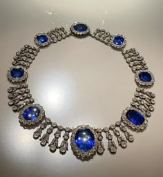 Vintage Queen Marie Amelies of France blue sapphire necklace in 915 sterling silver nd Cubic Zircon 17 inch long  Metal Purity:925 ⁵ Metal weight: 780.00 gram Stone :stimulated zircon CZ Clarity: AAAAA stone Ctw: 20.90ctw Gemstone: Blue sapphire  Gemstone creation: lab created  Item length:17.00 inch Item finished in 18k white gold plated on silver Luxury Sapphire Necklace For Formal Occasions, Luxury Sapphire Necklace Hallmarked, Formal Blue Oval Diamond Necklace, Classic Blue Diamond Necklace With 17 Jewels, Luxury Round Sapphire Diamond Necklace, Luxury Tanzanite Necklace With Brilliant Cut, Luxury Sapphire Diamond Pendant Necklace, Luxury Sapphire Gemstone Diamond Necklace, Luxury Sapphire Necklace With Brilliant Cut