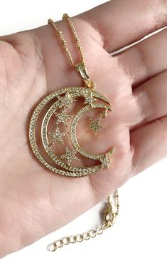 "Moon Necklace Gold This is an elegant and delicate satellite ball 18K gold plated chain with a gorgeous half moon and stars cubic zirconia gold plated pendant, finished with a comfortable lobster claw clasp. Length approximately: 17.5\" or 45 cm plus 1\" or 2.5cm extension chain. Pendant measure: 1.4\" or 3.55cm Each item is carefully shipped in a beautiful organza pouch, bubble wrapped and well protected. A lot of my jewelry is made with silver plated and gold plated solid brass or other metal Gold Celestial Necklace With Cubic Zirconia, Gold Necklace With Moon Charm And Cubic Zirconia, Gold Necklace With Moon Charm In Cubic Zirconia, Gold Crescent Moon Necklace, Moon Necklace Gold, Star Celestial, Crescent Moon Necklace Gold, Gold Crescent Moon, Moon Gold