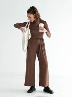 The Hana Jumpsuit is the ultimate done-in-one outfit. With its compressive bodice, high wasted culotte pant, and deep side seam pockets, it’s designed to be effortlessly elegant while simultaneously maximizing your comfort level. Wear it as is to a dance class, or to walk to the park. Or layer it with your favorite little cardigan and a hat to head out for the day. And its versatility doesn’t stop there — you can rock it with your favorite comfy heels for a night out. We aren’t exaggerating when Wide Leg Stretch Jumpsuits And Rompers For Loungewear, Stretch Wide Leg Jumpsuits For Loungewear, Chic Full Length Jumpsuits And Rompers For Loungewear, Versatile High-cut Leg Bottoms, Wide Leg Solid Color Jumpsuits And Rompers For Loungewear, Versatile Wide Leg Jumpsuit Or Romper, High-waist High-stretch Jumpsuit Or Romper, Solid Wide Leg Jumpsuits For Fall, Solid Color Wide Leg Jumpsuits For Fall