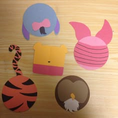 paper cut out animals and other items on a table