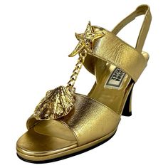 Check out this item from 1stdibs! S/S 1992 Gianni Versace Gold Mare Heel Heels Size 36: https://www.1stdibs.com/id-v_15863302 Gianni Versace 90s, Versace Boots, Italian Heels, Versace 90s, Crystal Pumps, Ysl Heels, Versace Gold, Knee High Heels, Funky Shoes