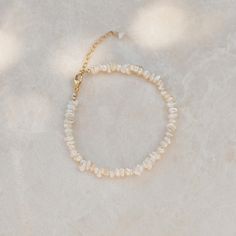 Crafted with rare flakes of freshwater keshi pearls, each individual pearl shimmers with a captivating iridescence, embodying the essence of the ocean. Hand threaded with silk complete with a versatile adjustable chain, the Leona bracelet allows for effortless layering, perfect for creating your own unique style infused with a bohemian laid back elegance. Specifications: 14k gold filled Freshwater keshi pearls 2-3mm 15-18cm adjustable Tarnish resistant * Good to know: All Ella Palm jewellery is Wedding Baroque Pearl Chain Bracelet, Wedding Bracelets In Pearl White Baroque Pearl, Pearl White Baroque Pearl Bracelets For Wedding, Wedding Baroque Pearl Bracelets In Pearl White, Wedding Baroque Pearl Beaded Bracelets With Pearl Drop, Wedding Baroque Pearl Beaded Bracelet With Pearl Drop, Wedding Jewelry With Oyster Bracelet And Baroque Pearl, Wedding Baroque Pearl Beaded Bracelets In Pearl White, Wedding Baroque Pearl Beaded Bracelets