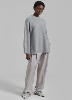 Color: Grey Melange Rib knit Relaxed fit Dropped shoulders Crew neckline Tonal embroidered logo Vented side seams Unlined 90% Wool 10% Cashmere Hand Wash or Dry Clean By Loulou Studio. Made in China Oversized Gray Cashmere Sweater, Gray Sweater With Ribbed Collar For Work, Gray Sweater With Ribbed Collar For Loungewear, Loulou Studio, Grey Sweater, Drop Shoulder, Crew Neckline, Rib Knit, Cashmere