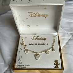 the disney love is bowtie necklace in its box