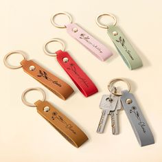 four keychains with different designs on them