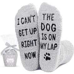 two socks that say i can't the get up dog is on right my lap now