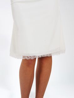 A perfect addition to any special occasion! With stunning lace trim details along the waistband and hemline, adorned with a small satin ribbon detail at the center front waist, you'll be sure to turn heads. Plus, the luxe stretch velvet and invisible zipper make for comfortable and effortless wear. Make sure to stay stylish with this amazing skirt! Match with our Londyn White Velvet Corset Top With Lace Trim (sold separately). Also available in teal! Materials: Stretch Velvet / Lace Length from Elegant Lace Bottoms With Lace Trim, Elegant Bottoms With Delicate Lace And Stretch, Elegant Stretch Bottoms With Delicate Lace, Elegant Stretch Lace Bottoms, Elegant White Bottoms With Lace Trim, Elegant Fitted Bottoms With Contrast Lace, Elegant Fitted Bottoms With Lace Trim, Elegant Wedding Bottoms With Delicate Lace, Elegant Fitted Bottoms With Delicate Lace