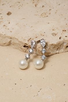 Indulge in timeless elegance with these crystal stud earrings with a delicate pearl drop on the end. Their subtle yet stunning design makes them a must-have accessory for any bride. Untamed Petals, Tulle Bodice, Pearl Veil, Veil Headpiece, Pleated Tulle, Girl Vibe, Organza Skirt, Ostrich Feather, Crystal Stud Earrings