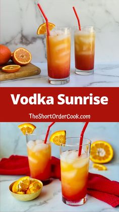 two glasses filled with orange juice and topped with strawberries next to sliced oranges