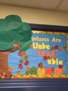 a bulletin board with an image of a tree and the words indians are under leaves on it