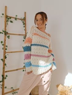 ✤ This wool sweater with dropped shoulders is pure softness and fluffiness, in addition to having cheerful colors without being too flashy. You can combine it in many different ways. ✤ I've crocheted this sweater using thick, premium acrylic wool that is completely hypoallergenic, ensuring it suits all types of skin, even the most sensitive. ✤ It's an incredibly comfortable sweater, long and slightly loose, with an openwork stitch, perfect for wearing a tank top or a dress underneath. The only part that isn't too loose is the sleeves they're not tight, but not as loose as the sweater itself. ✤ This chunky knit sweater has a boho style. This sweater is a size S/M. Nevertheless, here are its measurements so you can make sure of how it will fit you: - Length: 58 cm / 22,83 in - Width: 47 cm / White Knitted Sweater For Spring, Colorful Cozy Sweater For Spring, Casual White Long Sleeve Knitting Pattern, Cozy White Crochet Sweater, Cozy Multicolor Soft Knit Sweater, Spring Knitted Yarn Sweater, Multicolor Knitted Sweater For Spring, Multicolor Crochet Sweater For Spring, Trendy White Knitted Sweater