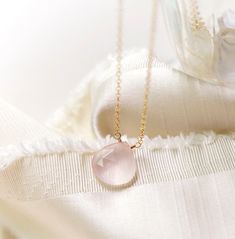 Natural Rose Quartz Teardrop Necklace - Sterling Silver or 14kt Gold Filled - Pale Pink Rose Quartz is a stone of love. It is believed to restore trust & harmony in relationships and encourage unconditional love. It purifies the heart and promotes self love, inner healing, and friendship. It is an alternate birthstone for January, as well as the spiritual birthstone for Taurus. This necklace is handcrafted with a natural, pale-colored Rose Quartz crystal. The stone is gem quality and therefore is more milky in coloring. Natural inclusions are present within each stone. The chain and clasp are available in sterling silver or 14kt gold fill. MATERIALS - Natural Rose Quartz - Stone Size: average 14mm (.62")  - Stone Shape: Faceted Heart Briolette - 14kt Gold Filled or Sterling Silver Chain & Crystal Photoshoot, Selenite Necklace, Rose Quartz Healing, Photoshoot Idea, Pink Rose Quartz, Tourmaline Bracelet, Rose Quartz Pendant, Inner Healing, Tourmaline Jewelry