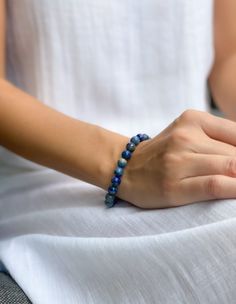 Lapis lazuli is a powerful stone for spiritual growth and enlightenment. This bracelet is designed to help you connect with the wisdom and power of lapis lazuli, and to promote your ongoing spiritual growth. The beautiful blue color of the stone is said to be associated with the divine, and wearing it can help you access your inner guidance and intuition. Holistic Blue Beaded Bracelets, Holistic Blue Beaded Bracelets For Meditation, Blue Lapis Lazuli Gemstone Beaded Bracelet, Sapphire Lapis Lazuli Bracelets With Round Beads, Spiritual Blue Beaded Bracelets For Meditation, Adjustable Blue Crystal Bracelet For Meditation, Spiritual Blue Lapis Lazuli Beaded Bracelets, Spiritual Sapphire Beaded Bracelets With Natural Stones, Sapphire Gemstone Beads Bracelet In Lapis Lazuli