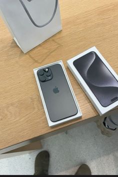 the new iphone 11 is in its box and next to it's original packaging