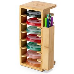 a bamboo container with several compartments and pencils in it for pens, markers and other office supplies