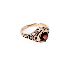 Unique antique style 14K Rose gold ring with a reel garnet stone and vintage ornament. 14K Rose Gold , and Garnet red stone. ring size is 7 us we make it any size you want weight : 2.7 gram top width : 9.5 mm Elegant Garnet Ruby Ring Stamped 14k, Vintage Rose Gold Jewelry With Intricate Design, Victorian Yellow Gold Ruby Ring With Intricate Design, Victorian Ruby Ring In Yellow Gold With Intricate Design, Victorian Style Engraved 14k Rose Gold Ring, Vintage Oval Garnet Birthstone Ring, Vintage Garnet Birthstone Promise Ring, Vintage Yellow Gold Garnet Birthstone Ring, Elegant Hallmarked Garnet Birthstone Ring