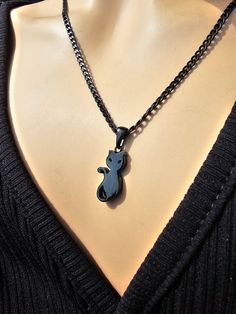 This is a blackened steel Gothic black cat kitty Pagan witchy Necklace that looks great alone or layered with others. Look at that cute kitty cat!! The minimalist design gives it a trendy and stylish feel, while the black steel gives it a touch of gothic Punk edge. This necklace runs approximately from 16 to 18 inches with a built-in extender.  This is a dainty chain, but is strong steel.. PLEASE NOTE FOR RETURNS! If I accept returns on your purchase (check when ordering, some items are "no retu Punk Style Black Necklace For Gift, Nickel-free Black Emo Jewelry, Black Stainless Steel Jewelry With Lobster Clasp, Black Stainless Steel Necklace With Lobster Clasp, Halloween Black Cat Design Jewelry, Hypoallergenic Black Punk Jewelry, Nickel-free Black Punk Necklaces, Black Nickel-free Punk Necklaces, Nickel-free Black Punk Necklace