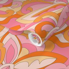 an orange and pink wallpaper with swirls on it