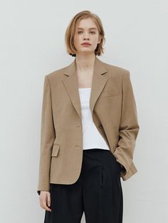 This is a feminine and modern jacket by WEARIS that is made out of high quality and sturdy material. With distinctive mood of the design and comfortable wear, you can style it for your comfortable daily outfit.- Relaxed semi oversized silhouette- Light and sturdy fabric with elasticity- Modern and minimal mood Modern Beige Blazer For Fall, Beige Sport Coat For Fall Workwear, Oversized Beige Modern Outerwear, Elegant Neutral Outerwear With Relaxed Fit, Fall Season Beige Sport Coat For Work, Oversized Khaki Blazer For Workwear, Modern Beige Blazer For Winter, Oversized Beige Blazer With Lapel Collar, Modern Beige Outerwear For Office