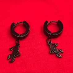 Have Style That Stings With These Scorpion Hoop Earrings! - Black Enamel Painted Metal Thick Hoops With A Scorpion Charm! - Clicks Open And Closed With A Hinge In The Middle Of The Earring. - Unisex! Great For Feminine, Masculine, And Androgynous Styles! - The Scorpion Charm Measures Approximately 0.50 X 0.25 Inches. - The Hoop Diameter Is Approximately 0.50 Inches. - Total Length Is Approximately 1.25 Inches. Black Small Hoop Earrings With Ear Wire, Trendy Black Pierced Hoop Earrings, Adjustable Black Pierced Hoop Earrings, Metal Scorpion, Garnet Teardrop Earrings, Vintage Christmas Earrings, Feminine Masculine, Fox Earrings, Football Earrings