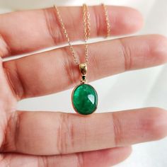 This stunning pendant is set in 14k Solid Yellow Gold with Natural Emerald with utmost precision. It is an unique gemstone pendant for nearly every occasion and is completely hassle-free jewelry. ITEM DETAILS: * Gem: Emerald * Gem Size: 9.5x11.5mm * Gem Shape: Oval * Gem Weight: 4.38 carats * Gold Purity: 14KT * Gold Weight: 0.52 gram * Total Weight of the Pendant: 1.40 gram The Gold purity is guaranteed and it comes with authentic 14KT gold hallmark. Since my items are handmade, they are absolutely nickel and lead free. CUSTOMIZATION: * Gemstone customization is available and it can be substituted with a gem of your choice. Kindly message me for the same. PACKAGING * The Pendant comes with layers of safe and secure wrapping along with Free handmade jewelry box with every purchase. ➡️Head 14k Gold Gemstones With Bezel Setting For Gift, 14k Gold Jewelry With Cabochon For May Birthstone, 14k Gold Cabochon Jewelry For May Birthstone, 14k Gold Emerald Necklace With Round Pendant, Oval Hallmarked Emerald Necklace Gift, Handmade Oval Emerald Necklace Gift, 14k Gold Bezel Set Oval Pendant Jewelry, Emerald Oval Pendant Necklace As Birthstone Gift, Gift Emerald Necklace With Bezel Setting