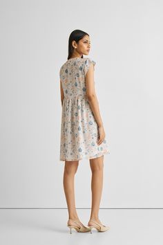 Elevate your summer style effortlessly with our 'Cap Sleeved Short Dress in Florals.' Crafted from 100% Bemberg™ Crepe, this dress embodies comfort and style. Designed for both ease and elegance, this dress has a regular fit complemented by comfortable cap sleeves and convenient pockets on both sides. Versatile for various occasions, this dress offers a perfect blend of chic florals and comfort, ensuring you stay cool and fashionable during the warmer seasons. Embrace the calming hues and breezy Feminine Summer Viscose Mini Dress, Chic Relaxed Fit Viscose Dress, Floral Print Relaxed Fit Dress For Garden Party, Relaxed Fit Floral Print Dress For Garden Party, Relaxed Fit Viscose Dresses For Daywear, Elegant Relaxed Fit Dress For Vacation, Floral Print Relaxed Fit Dress For Daywear, Relaxed Fit Floral Print Day Dresses, Relaxed Fit Floral Print Dresses For Day Out