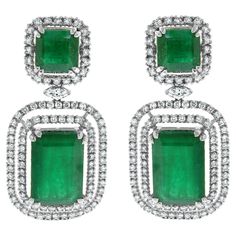 The Renee Emerald & Diamond Earrings are a unique and luxurious heritage pair with royal green emeralds and diamonds set in white gold. Gemstones Type: Emerald Gemstones Shape: Rectangular Gemstones Weight: 25.01 ct Gemstones Color: Green Diamonds Shapes: Round & Marquise Total Diamonds Weight: 3.01 ct Diamonds Color: H - J Diamonds Clarity: VS - SI (Very Slightly Included - Slightly Included) Metal: 14K Gold Metal Wt: 17.4 gms Setting: Prong Set Price Quoted may be negotiable. Please contact us to view and discuss. Luxury Green Diamond Earrings, Green Diamond Earrings With 17 Jewels For Formal Events, Green Diamond Earrings With 17 Jewels For Formal Occasions, Luxury Green Diamond Earrings With Prong Setting, Emerald Diamond Earrings For Formal Events, Formal Emerald Diamond Earrings, Emerald Diamond Earrings For Formal Occasions, Luxury Green Diamond Earrings For Wedding, Luxury Emerald Diamond Earrings