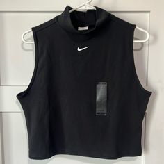 Black. New With Tags. Machine Washable. Nike Training Tops For Spring, Sporty Black Tops With Medium Support, Nike Sleeveless Tops For Streetwear, Casual Black Tops With Go-dry, Black Activewear For Spring Sports, Black Activewear For Spring Training, Spring Season Black Activewear For Gym, Black Spring Activewear For Sports, Casual Black Activewear For Workout