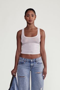 DESCRIPTIONThe Kyoto Tank is the perfect sheer, form-fitting tank that feels like butter. Your new not-so-basic, "basic" you'll find yourself wearing daily. DETAILSScoop Neck Style, 95% Micro Modal 5% Spandex Model is 5'7 & wearing a size S MADE IN LOS ANGELES, USA