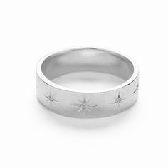 The Star ring features stars engraved along the band with Cubic Zirconia stone. The beautifully decorated ring looks great on its own or stacked with other rings. Match it with the star necklace or star earrings for a celestial look. Buy for yourself or as a gift. Celestial Style Promise Jewelry With Single Cut Diamonds, Celestial Single Cut Diamond Promise Jewelry, Silver Star-shaped Jewelry With Single Cut Diamonds, Silver Celestial Jewelry For Promise, Celestial Silver Jewelry For Promise, Silver Celestial Jewelry For Promise Occasion, Star-shaped Engraved Rings For Anniversary, Celestial Silver Jewelry With Single Cut Diamonds, Star-shaped Diamond Jewelry For Promise