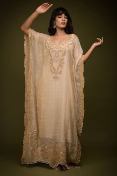 Ivory and beige cutdana embroidered cutwork floral swirl patterns. Comes with an inner. - Aza Fashions Eid V-neck Kurta With Intricate Embroidery, Elegant V-neck Georgette Kaftan, Silk V-neck Traditional Wear For Wedding, Cream Embroidered Chanderi Dress, Bollywood Style V-neck Dress With Chikankari Embroidery, Beige Embroidered Floor-length Dupatta, Beige Embroidered Fabric For Reception, Embroidered Chanderi Cream Dress, Beige Saree Dress With Resham Embroidery