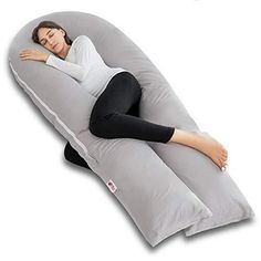 a woman laying on an inflatable pillow with her arm resting on the back