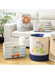 various toy storage containers on the floor in front of a white couch with a stuffed animal