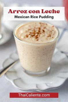 mexican rice pudding in a glass on a white plate with spoons next to it