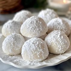 powdered sugar balls on a white plate