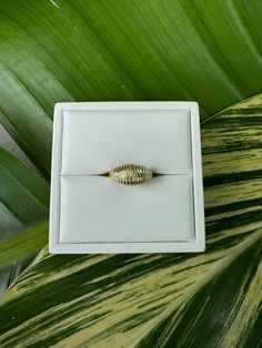 Vintage 14k Solid Gold Dome/ Shrimp Ring Description: This vintage 14k solid gold dome ring, also known as a shrimp ring, features detailed ridges on top. Weighing 3.5 grams and sized at 6 (sizable), this ring is a unique and stylish addition to any jewelry collection. This piece, like all our jewelry, is a rare find—once it's gone, it's gone. Choosing this piece is a win-win: You'll stand out from the crowd and help the environment by shopping sustainably! Why You'll Love It: Bold Design: The dome shape and detailed ridges make a bold statement. Versatile Fit: The ring is sizable, allowing for a perfect fit. Rare and Exclusive: Our pieces are often one-of-a-kind. Don’t miss this exclusive item. Details: Material: 14k Solid Gold Weight: 3.5 grams Size: 6 (sizable) Style: Bold, Unique Perfe Antique 14k Gold Dome Ring For Weddings, Antique 14k Gold Domed Rings, Fine Jewelry Open Dome Ring With Diamond Cut, Antique Domed 14k Gold Rings, Heirloom 14k Gold Snake Ring For Formal Occasions, Heirloom Yellow Gold Dome Ring For Promise, Yellow Gold Dome Ring With Diamond Cut, Heirloom 14k Gold Round Snake Ring, 14k Gold Diamond Cut Dome Ring For Wedding