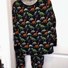 Brand New With Tags Hyde And Eek Halloween Pjs Print Is In A Fun Dinosaur Skeleton Print With Bright Halloween Colors Size 2xl Perfect For Your Halloween Night Stay At Home In Your Cool Pjs Or Wear Them Out For Halloween Fun! Cool Pjs, Bright Halloween, Halloween Pjs, Reindeer Pajamas, Mickey Shorts, Dinosaur Pajamas, Halloween Colors, Blue Lounge, Silk Tee