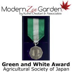 the green and white award medal is displayed