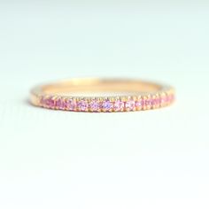 18K Yellow Gold Pink Sapphire Ring, 3/4 Eternity Ring, Natural Pink Sapphire Wedding Band, 1.5mm Half Eternity Band, Micro Pave Wedding Ring ♥ Details Handmade to order * Genuine Pink Sapphire Band in 3/4 eternity * Gemstone type: Natural Pink Sapphires * Total Carat Weight: 0.44 carats * Sapphire size: 1.5mm each * Sapphire Cut: Round Brilliant fully Faceted Diamond Cut * Metal: Solid 18K Gold (available in 14K and 18K White, Yellow, and Rose Gold, and 950 platinum) * Ring size: US 3-10 (Please Pink Sapphire Wedding Band, Pave Wedding Ring, Micro Pave Band, Pink Sapphire Band, Pave Wedding Rings, Sapphire Wedding Band, Sapphire Band, Pink Sapphire Ring, Pave Band